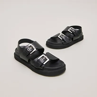 Double buckle sandals in glazed black leather