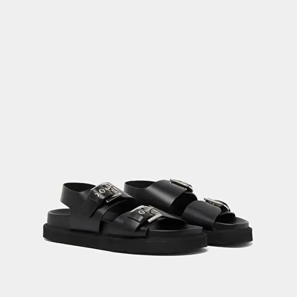 Double buckle sandals in glazed black leather