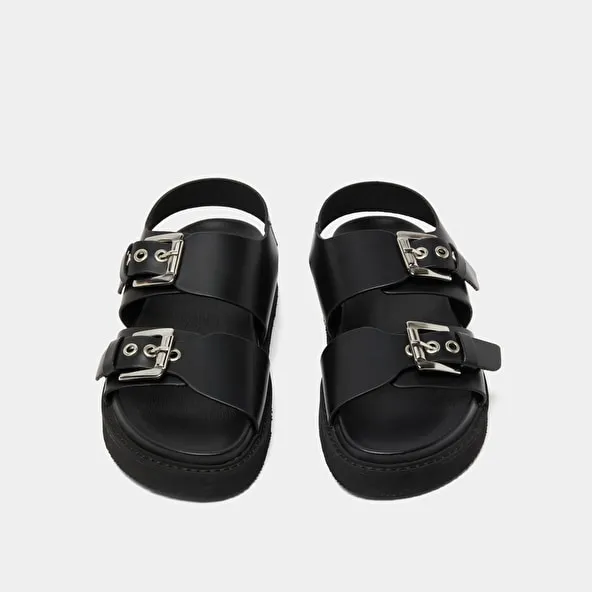 Double buckle sandals in glazed black leather